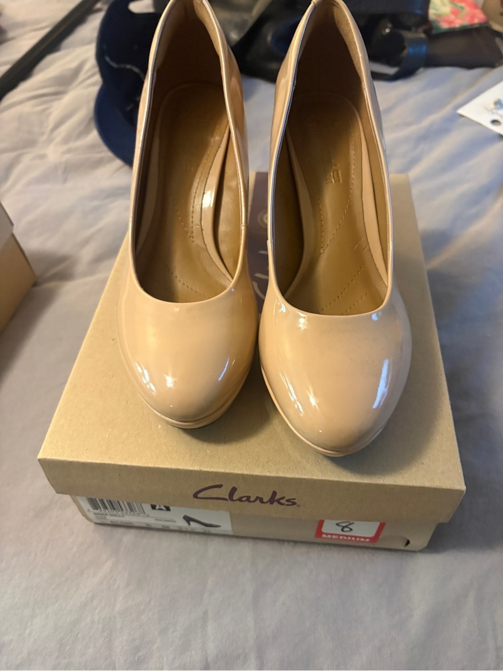 Clarks Women’s Beige Patent Round-Toe Pumps